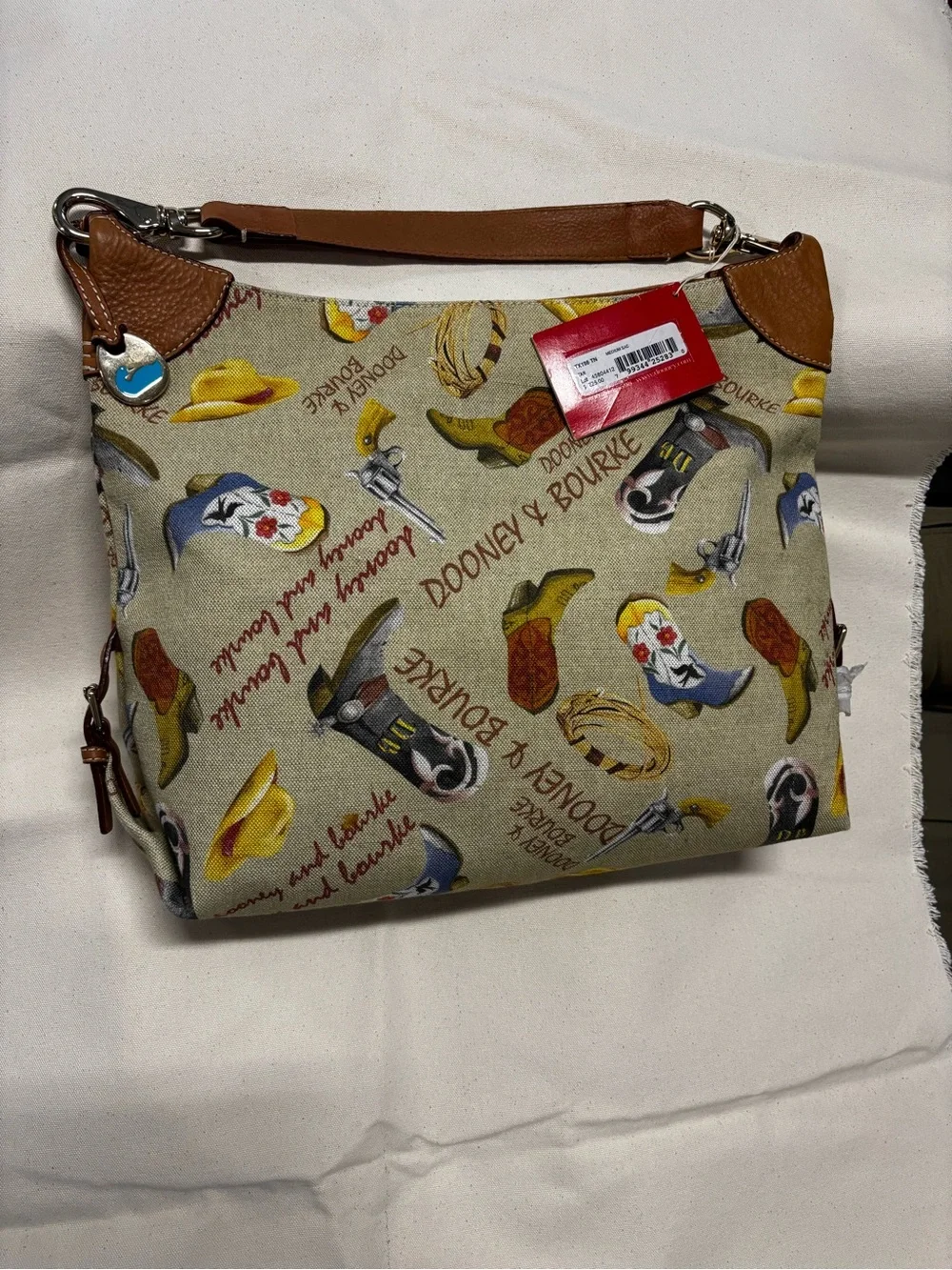 Dooney & Bourke Beige Canvas Western Print Shoulder Bag with Brown Leather Trim - Picture 2 of 6